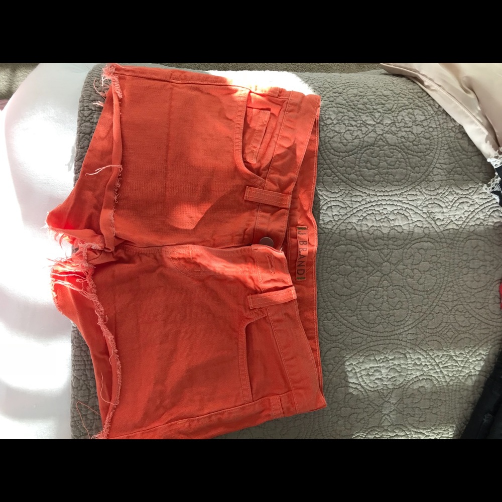 J Brand orange cut offs